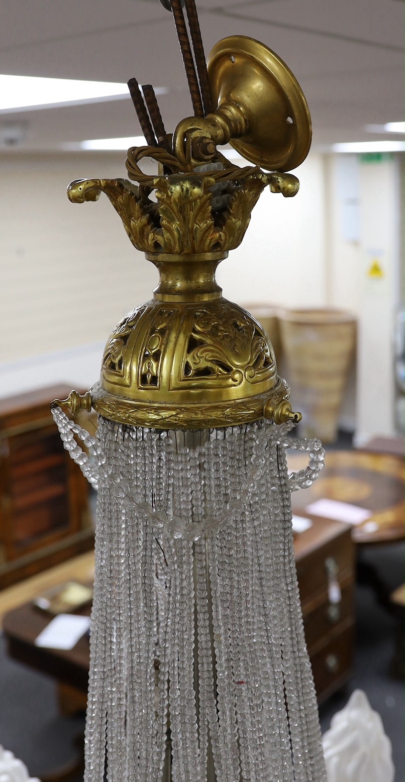 A cut and beaded glass and ormolu bag chandelier, approx 96cms high, approx 75cm diameter